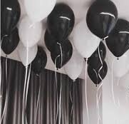 10 Gas filled black and white Balloons tied to ribbons