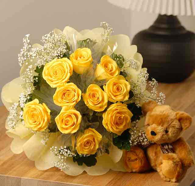 20 yellow roses in a basket with a teddy.