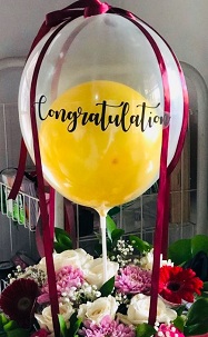 15 white red flowers with 1 Balloon in colourless balloon with congratulations print on balloon