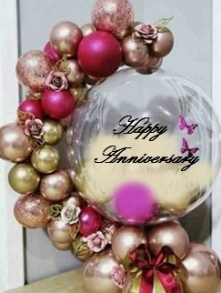 Clear happy anniversary printed Balloon encircled with gold pink balloons flowers and leaves