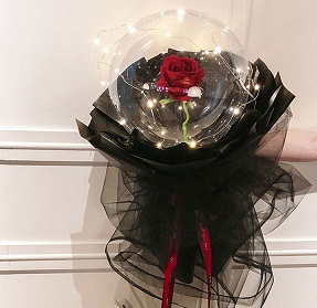 Transparent balloon with 1 red rose black wrapping and fairy lights 