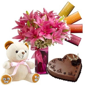 6 lilies vase, 4 temptation chocolates, 1/2 kg Cake,6 inch teddy