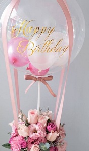 Transparent Balloon with happy birthday print on balloon and 20 pink flowers basket
