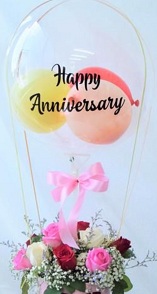 Happy anniversary transparent printed transparent balloon with 4 pink balloons and 20 pink roses arrangement