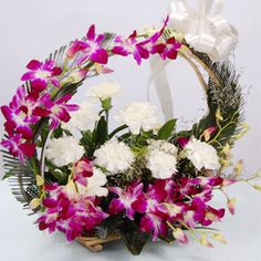 5 purple orchids 6 carnations arrangement