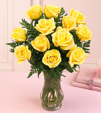 6 yellow roses in a vase.