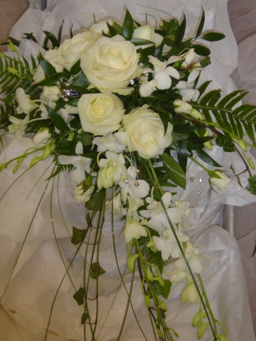 Orchids and roses arrangement.