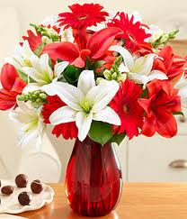 Gerberas lilies flowers vase.