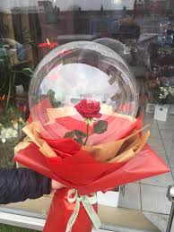 1 transparent balloon 1 red rose arrangement with red wrapping 